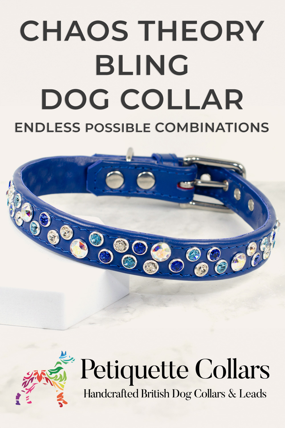 Blue leather dog collar with scattered Swarovski crystals in blue, silver, and iridescent tones, displayed on a marble surface with Petiquette Collars branding.