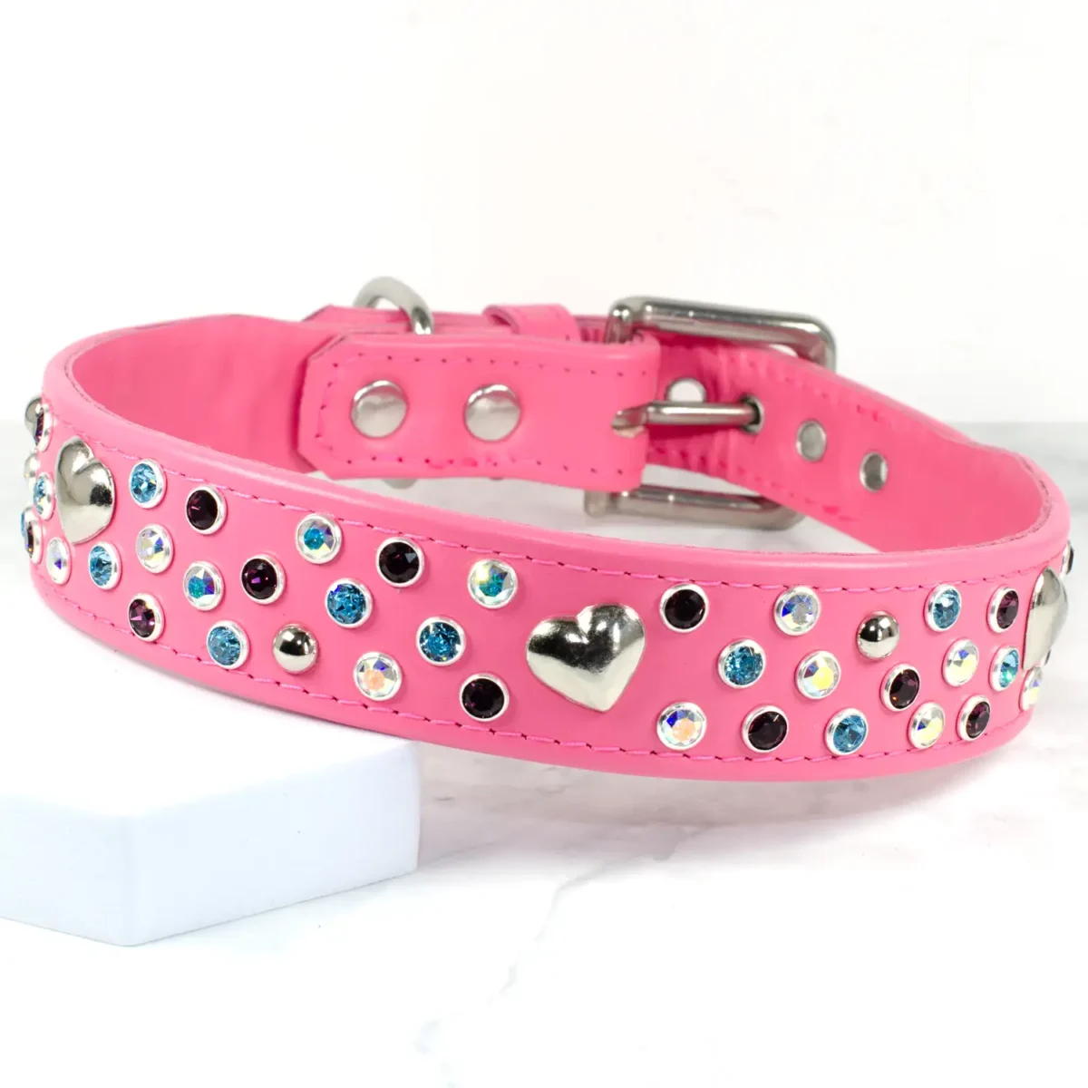 A pink studded dog collar with hearts and Swarovski crystals, handmade by Petiquette