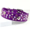 a wide purple leather dog collar with pink and clear Swarovski crystals