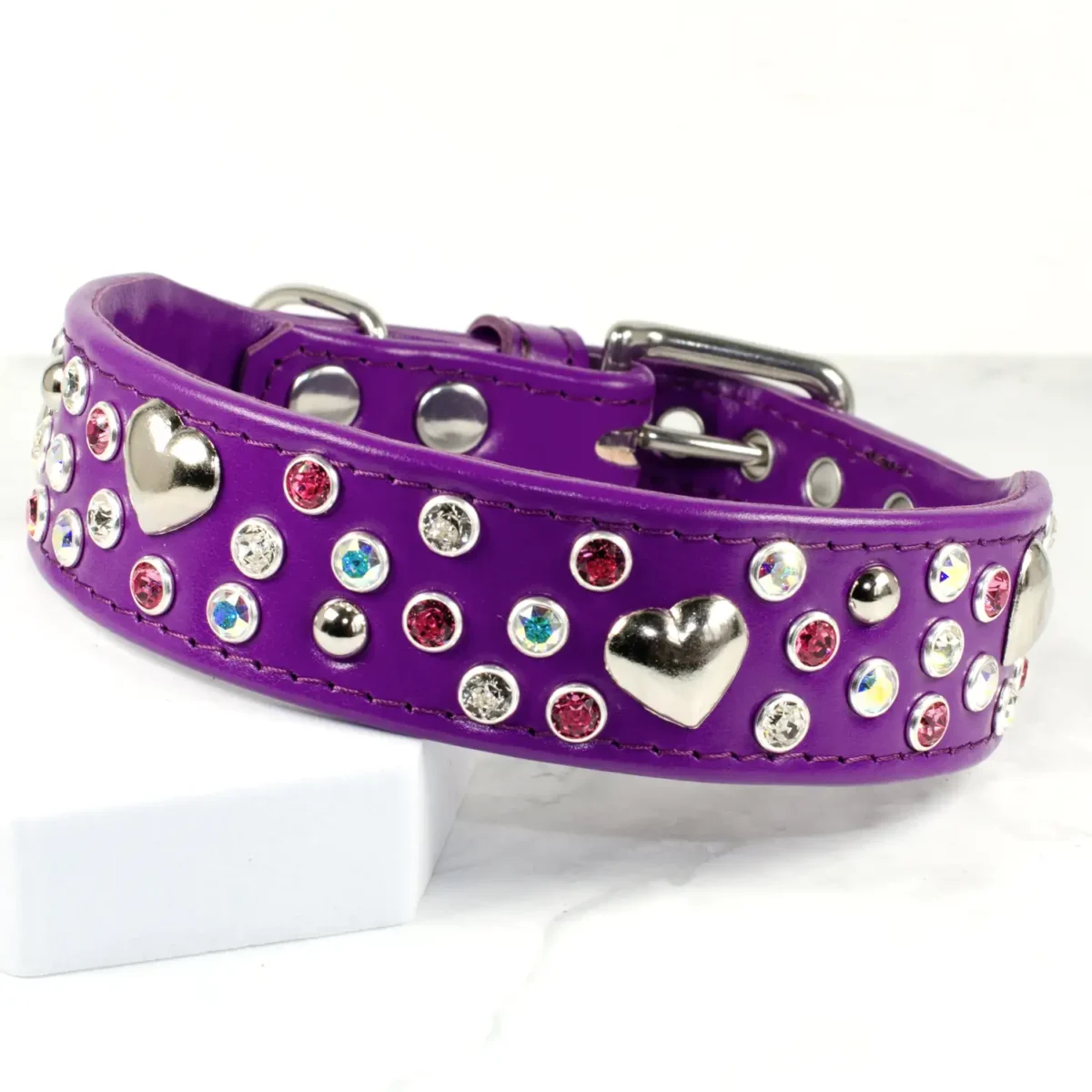 a wide purple leather dog collar with pink and clear Swarovski crystals