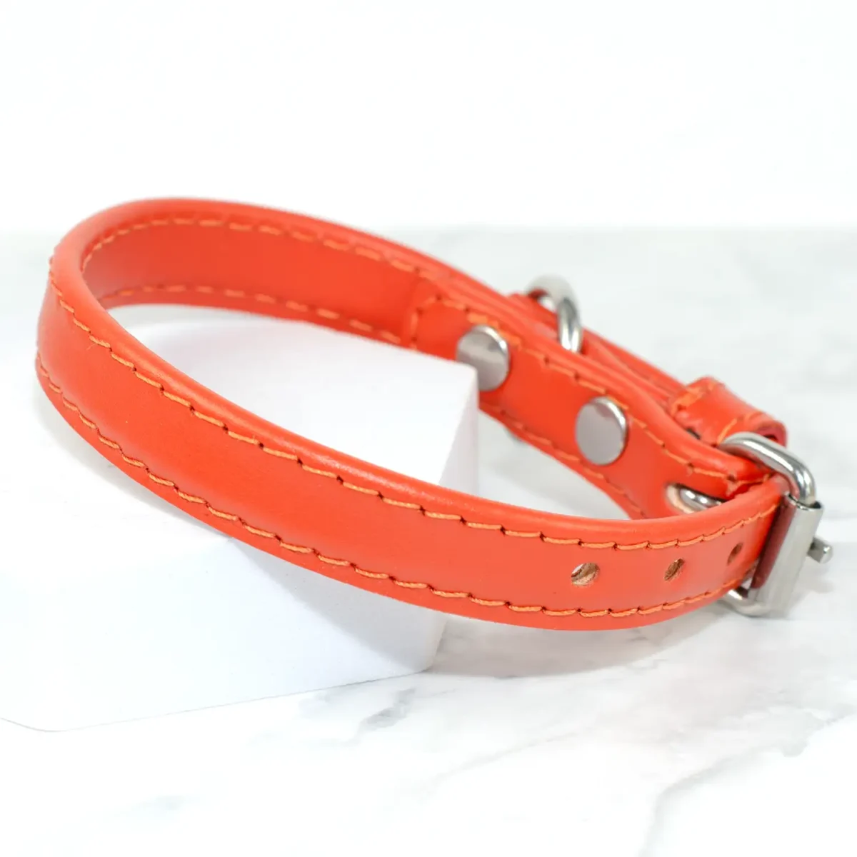 a soft leather orange puppy collar made by Petiquette
