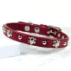 a burgundy leather dog collar with skull studs, handmade by Petiquette Collars