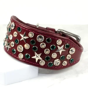 A burgundy coloured leather Whippet collar encrusted with gleaming Swarovski crystals and silver star shaped studs. Handmade by Petiquette
