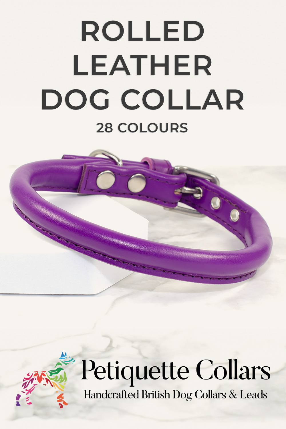 Purple rolled leather dog collar with stainless steel buckle, displayed on a marble-effect background with Petiquette Collars branding.