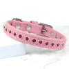 A pink leather dog collar with a row of rose coloured Swarovski crystals, handmade by Petiquette Collars