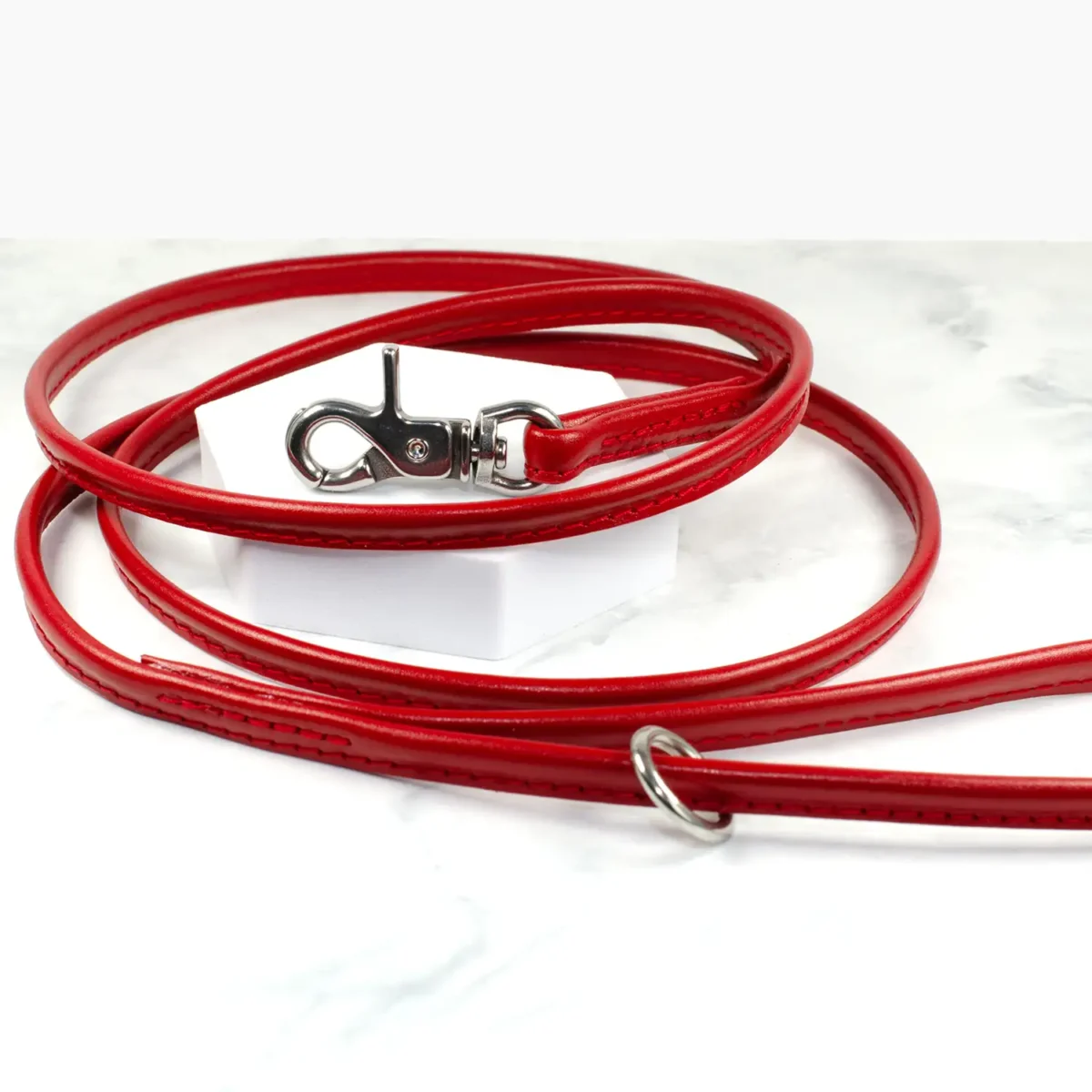 a vibrant red lightweight leather lead with silver trigger clasp, made by Petiquette