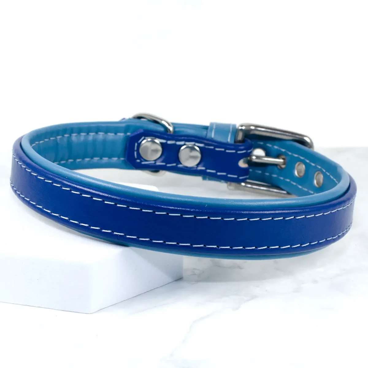 a blue padded leather dog collar handmade by Petiquette