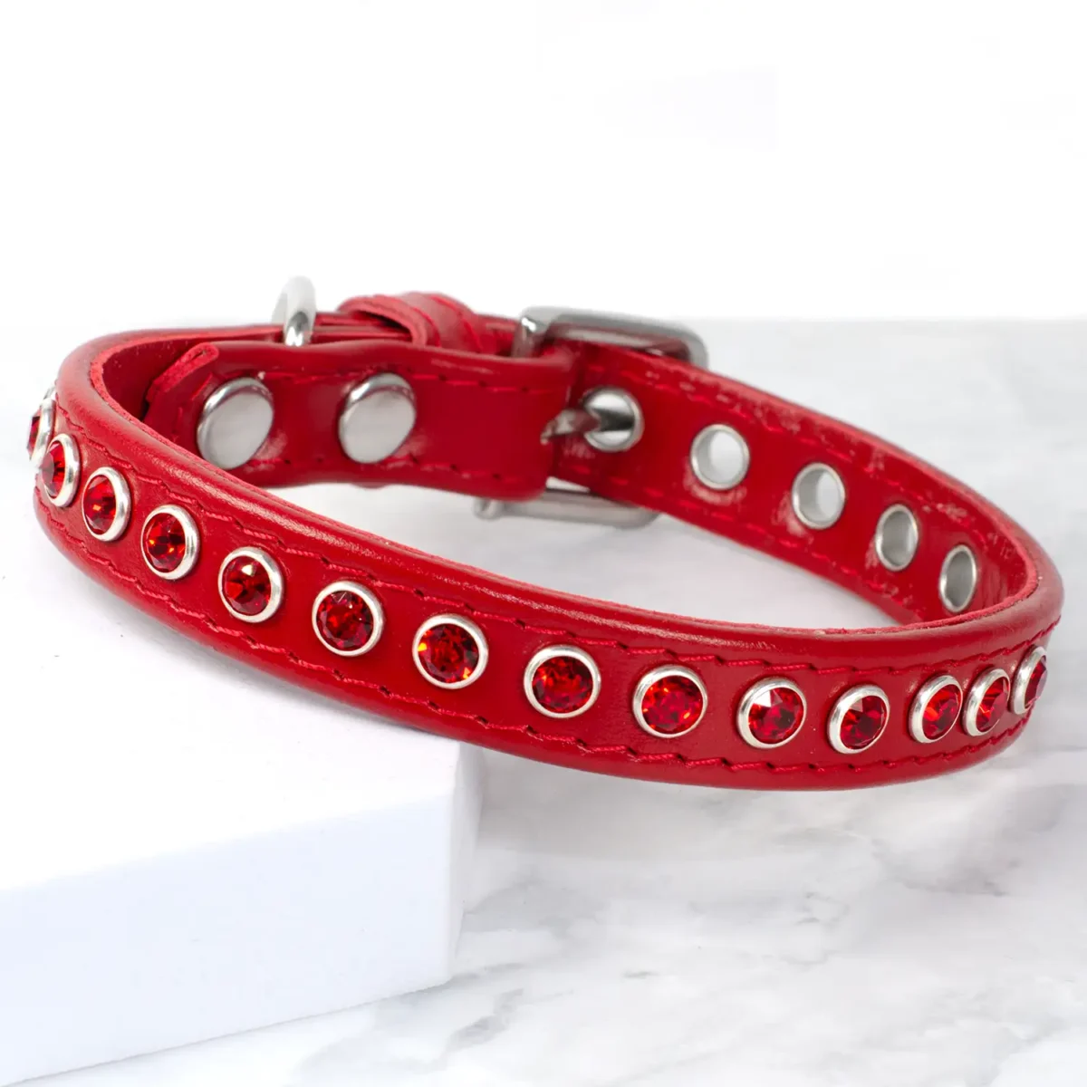 a red leather dog collar with light siam Swarovski crystals to fit a dog with a neck size of between 9"-11", handmade by Petiquette