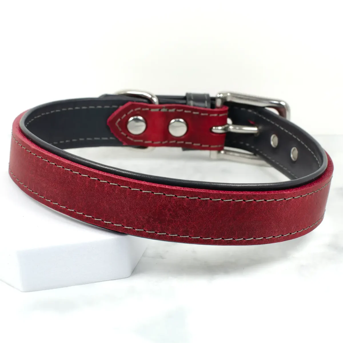 A traditional Oxblood coloured leather dog collar, handmade by Petiquette