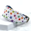 A rainbow star printed leather sighthound collar called Cosmic Confetti, handmade by Petiquette