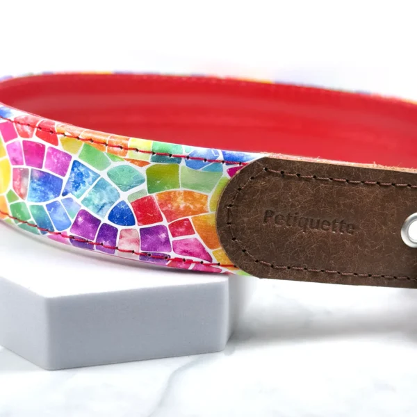 Close-up of the Petiquette-stamped brown Italian leather buckle strap on the Rainbow Mosaic printed leather dog collar