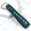 a teal leather keyring with swarovski crystal