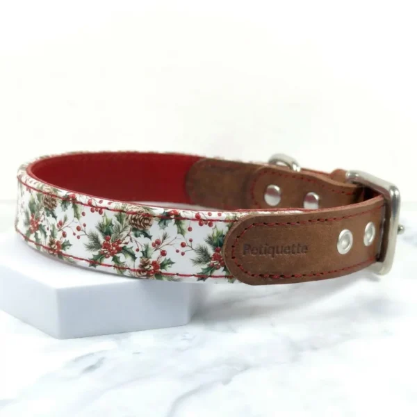 A handmade leather dog collar with holly printed leather and a brown vegetable tan strap by Petiquette Collars
