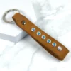 a tan leather keyring with swarovski crystal